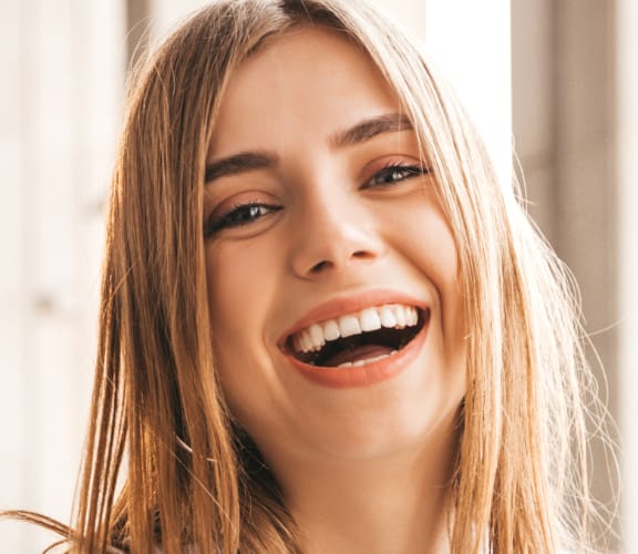 Woman outside laughing