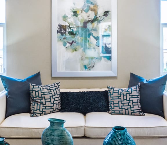 A couch and table in a nicely decorated living room